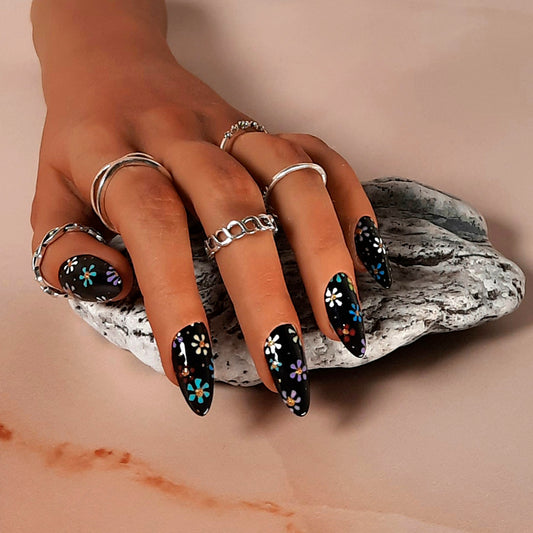 black almond press on nails with hand painted flowers in a mix of colours