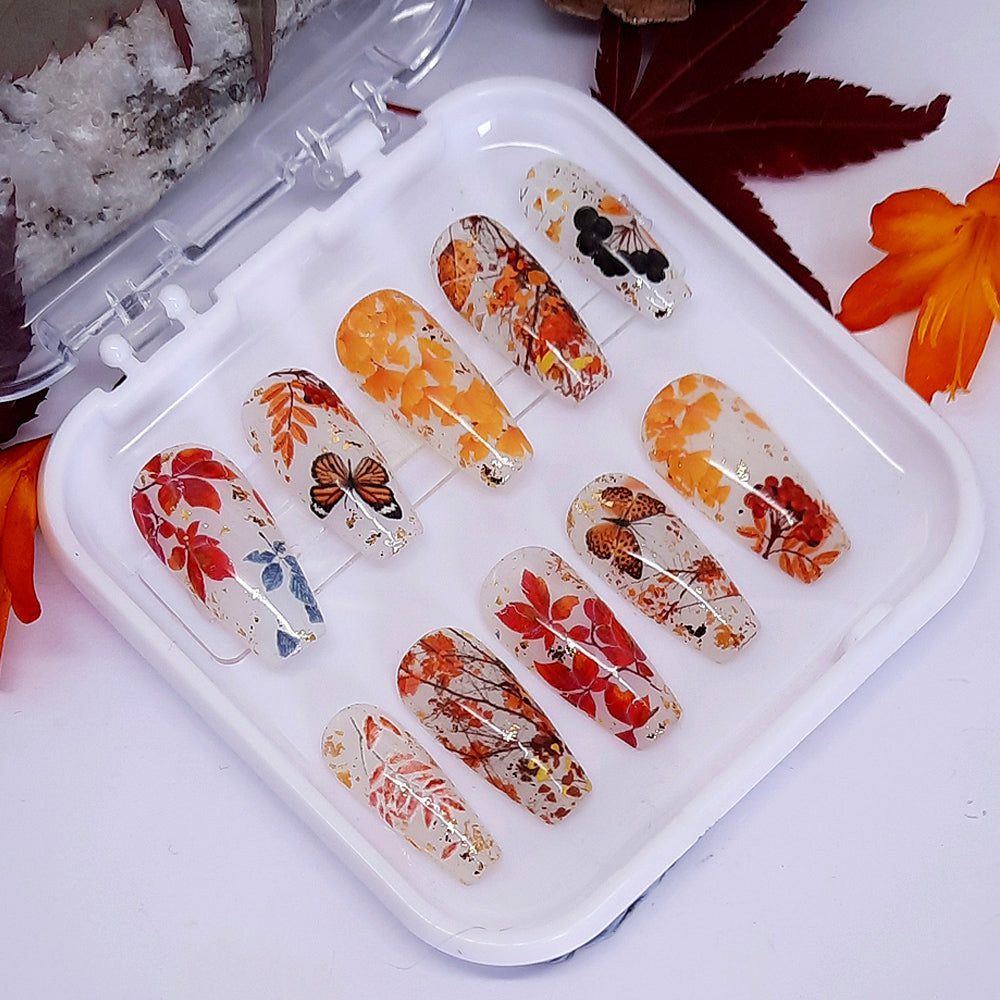 pretty milky white press on nails with Autumn leaves and gold flakes