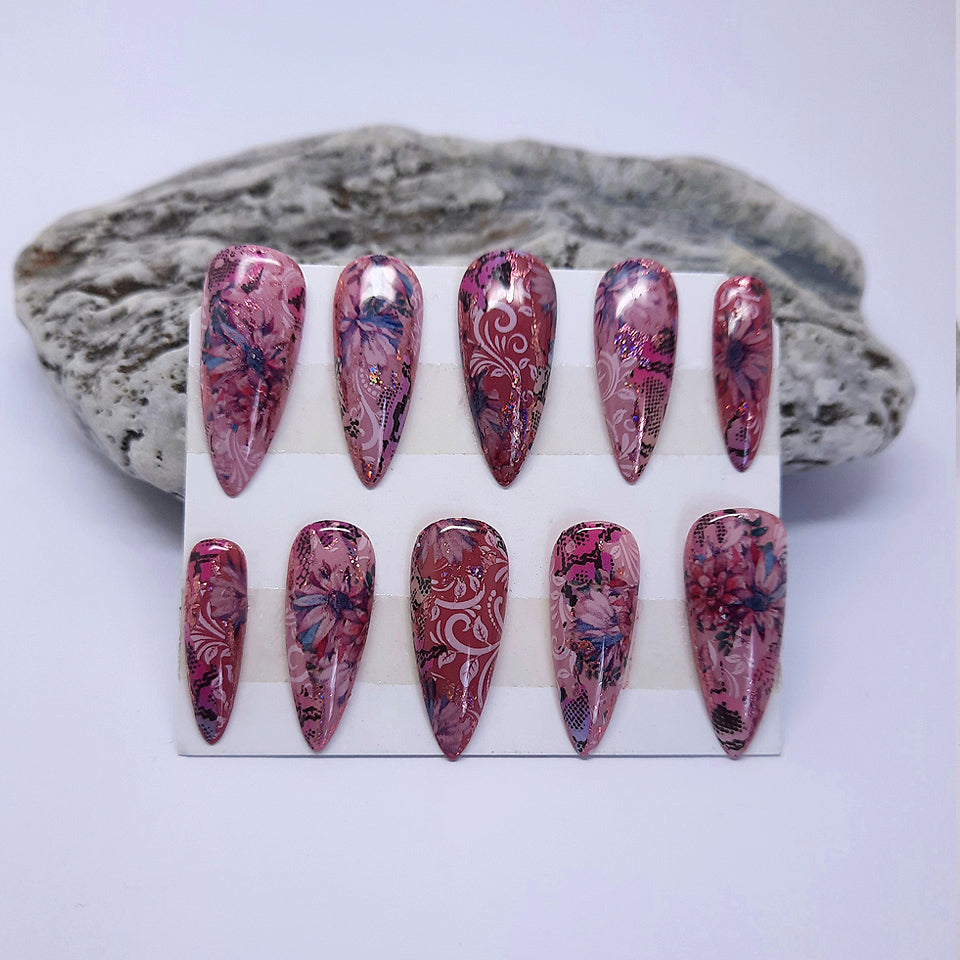 very pretty pink hand made stiletto press on nails with and abstract floral design