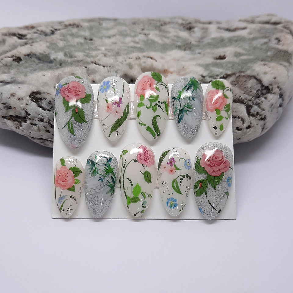 milky white hand made press on nails with glitter and pink roses and lily of the valley flowers