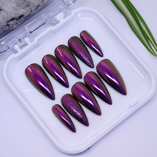 A stunning set of hand made press on nails in dark pink colour shift chrome, with bubble art accent on the ring finger nails.