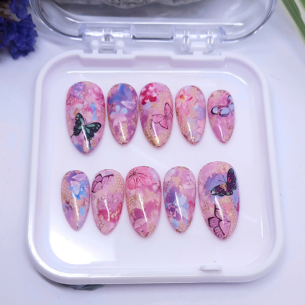 Pretty pale pink hand made press on nails with flowers and butterflies.