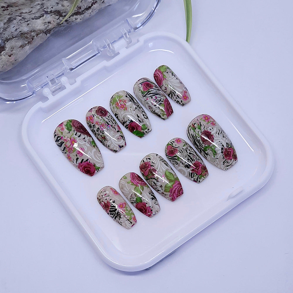 Pretty hand made press on nails in an abstract design with pink roses and animal print.