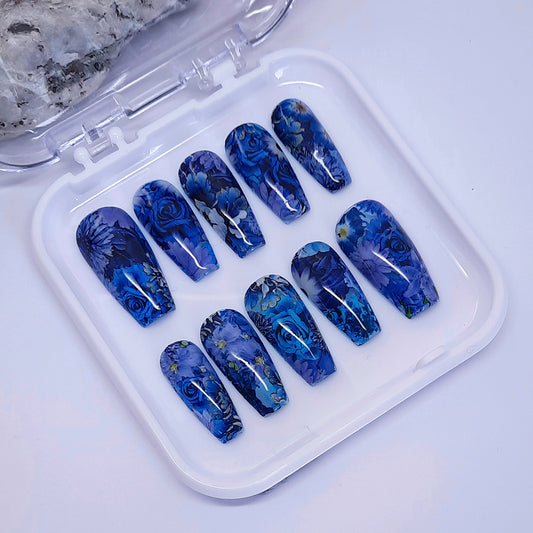 stunning hand made press on nails completely covered in blue flowers