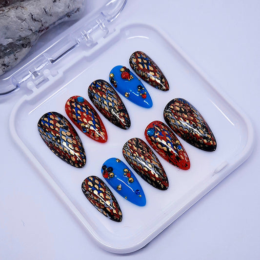 Set of colourful nail art in an abstract design displayed in a white case.