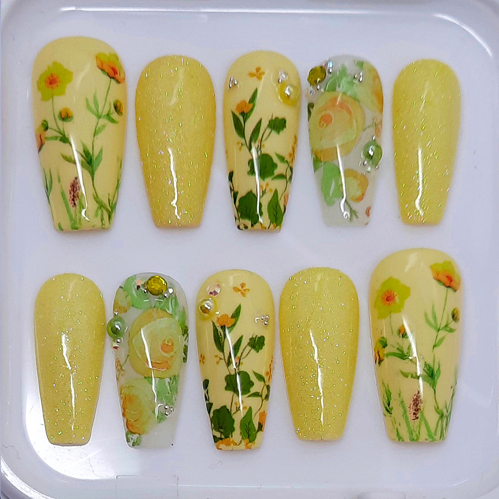pretty pastel yellow hand made press on nails with flowers, glitter and gems