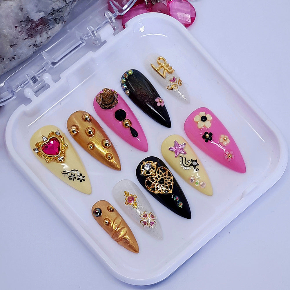 pink , black, yellow and gold press on nails with 3d nail art