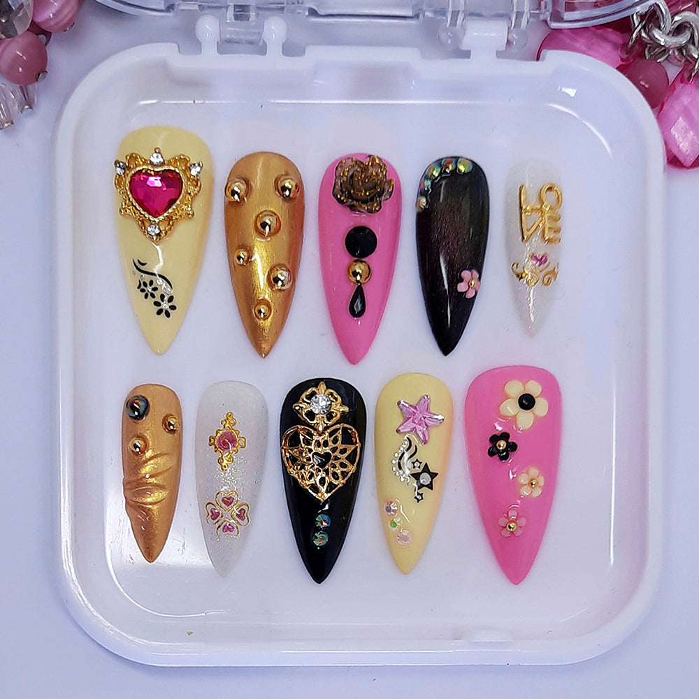 pink , black, yellow and gold press on nails with 3d nail art