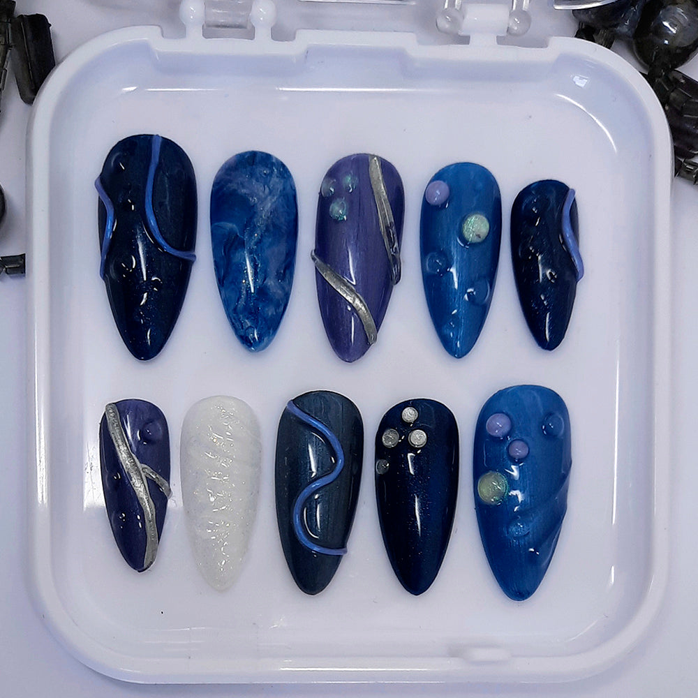 Stunning hand made press on nails in shades of blue with 3d nails art