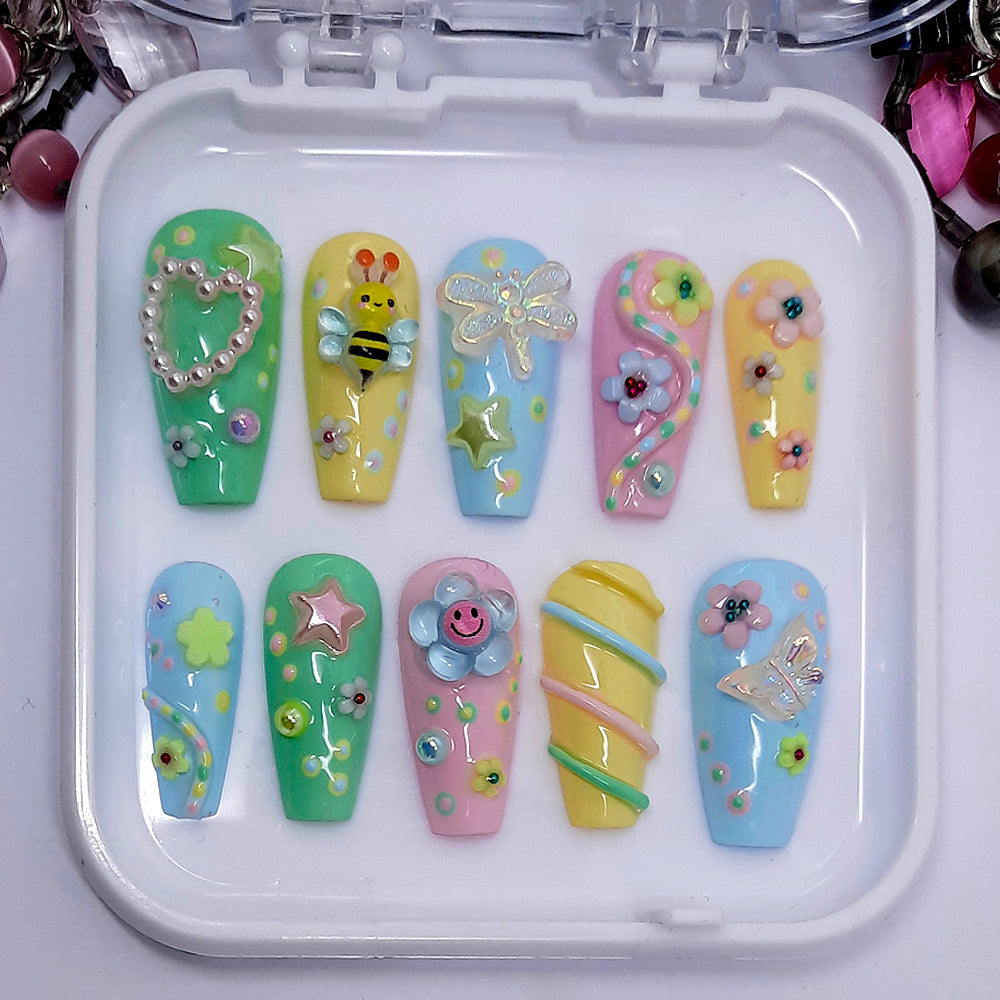 beautiful pastel hand made press on nails with a cute 3d design