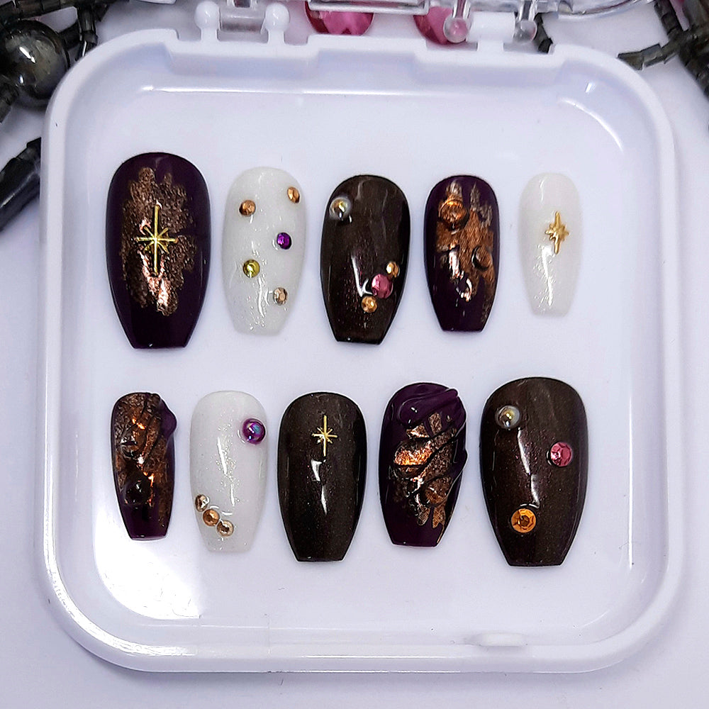 bronze, dark purple and milky white press on nails with 3d swirls and nail art