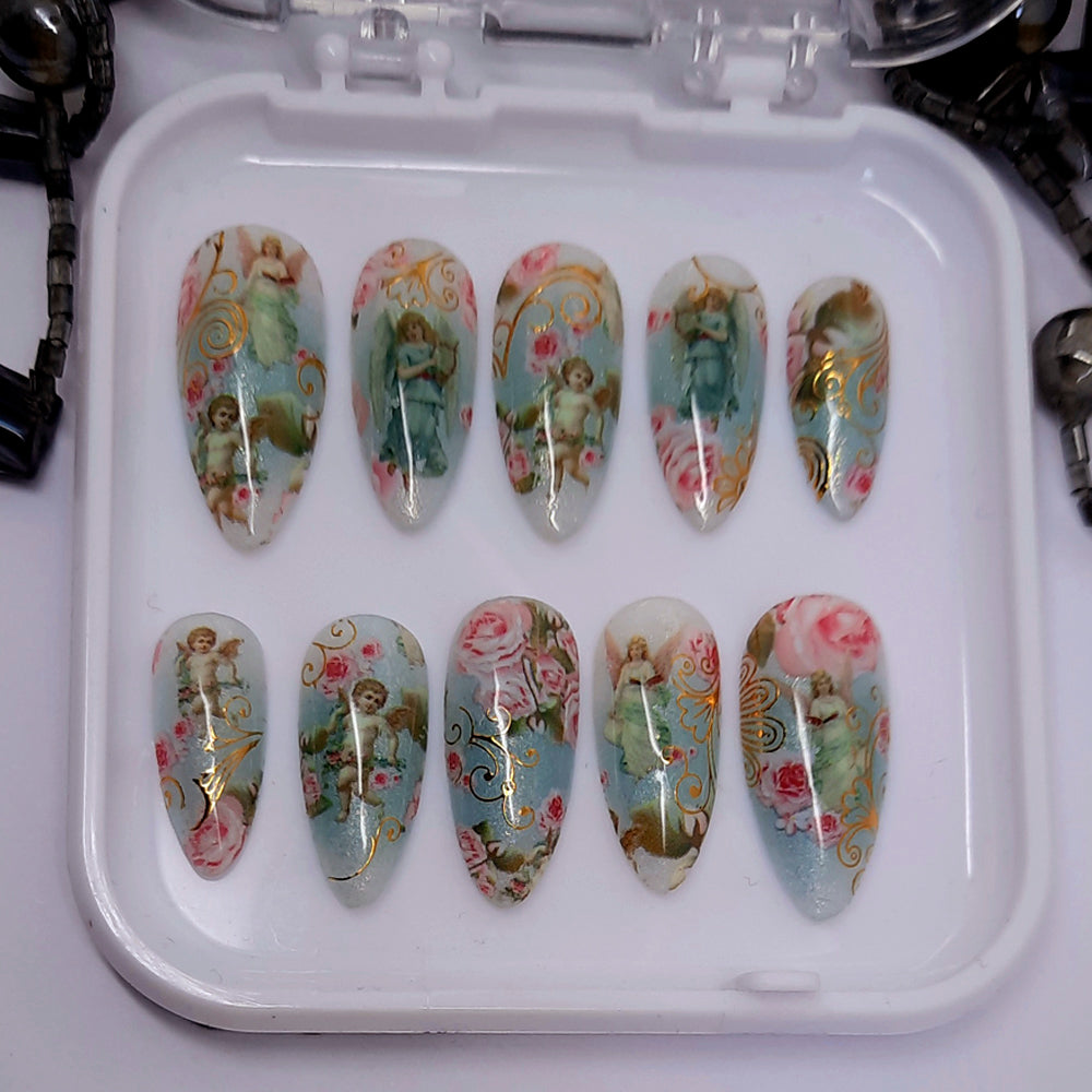 beautiful press on nails with cherubs, angels, pink roses and gold swirls