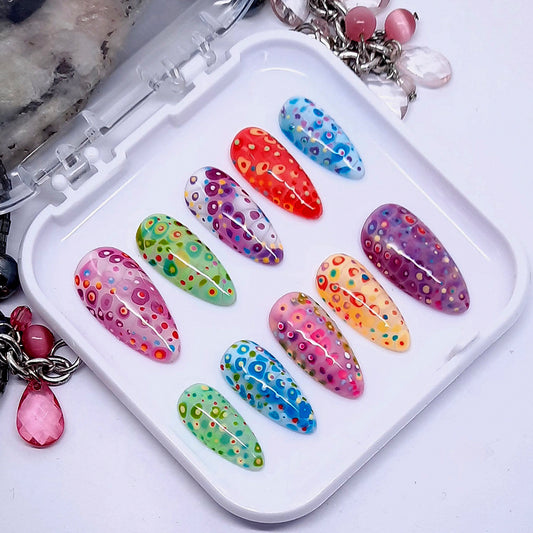 Very beautiful bright and colourful blooming press on nails in a fun design. Finished in gloss top coat.