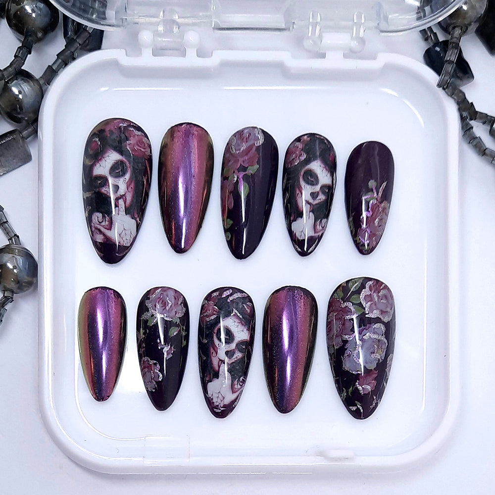 Gorgeous darkest purple press on nails with pink roses, pink/gold colour shift chrome and Halloween vibes. Finished in gloss top coat