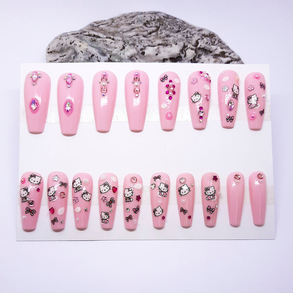 Set of pink nail designs with cartoon characters on a white background