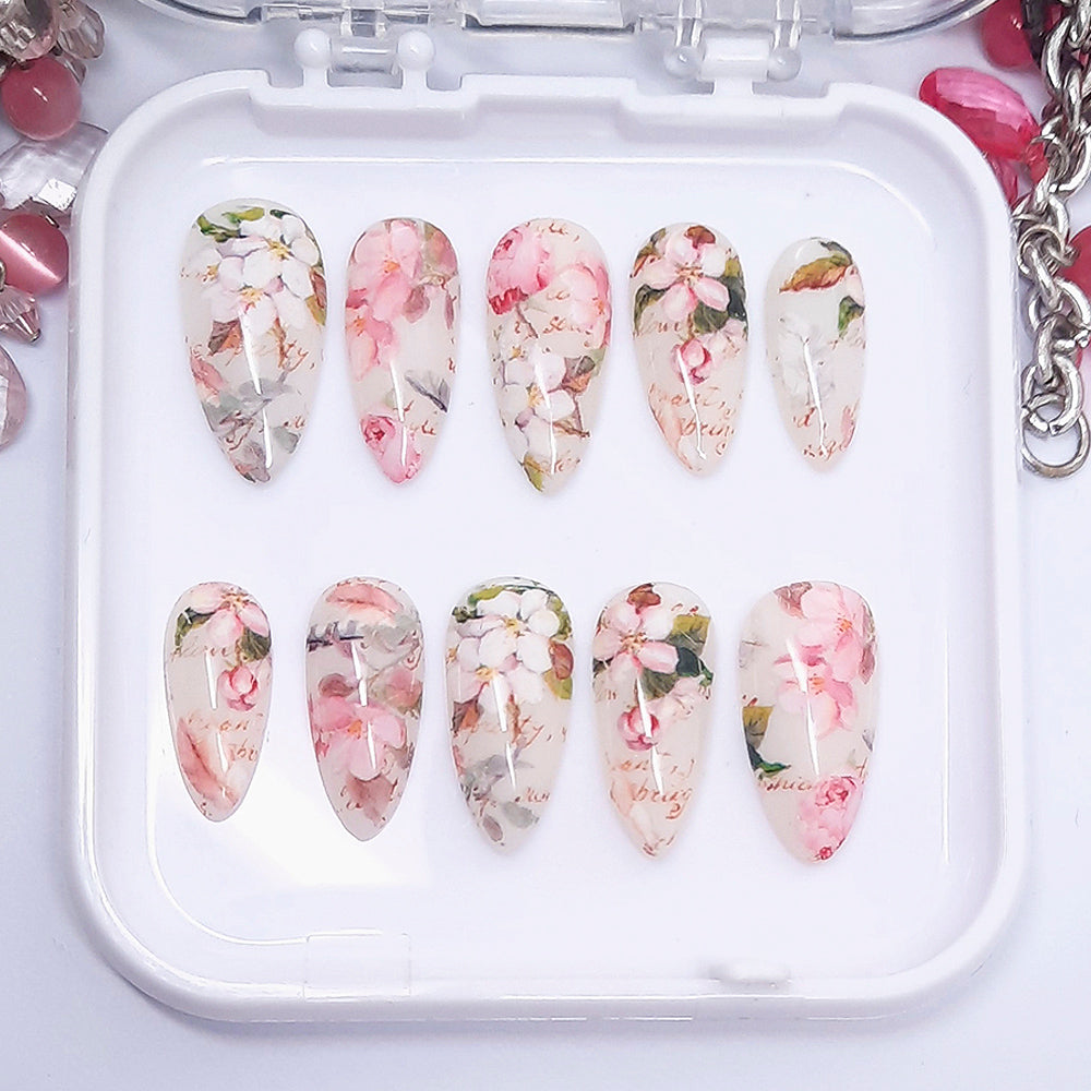 Set of floral nail art designs in a white tray