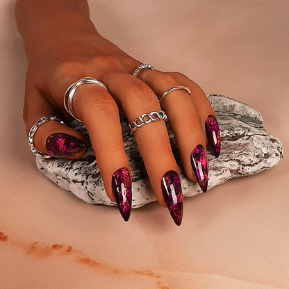 hand made black stiletto press on nails with neon pink swirls