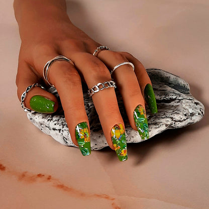 green hand made coffin press on nails with yellow flowers and silver flecks