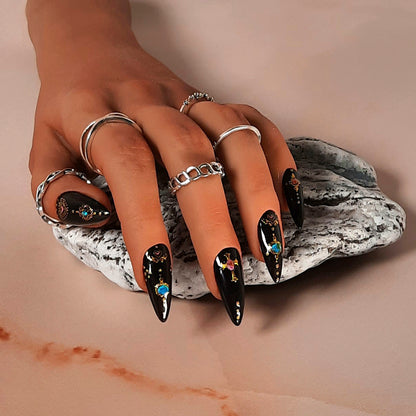 hand made black stiletto press on nails with a goth vibe