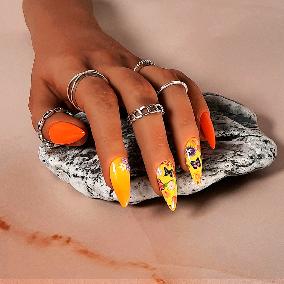 orange and yellow hand made stiletto press on nails with flowers and butterflies