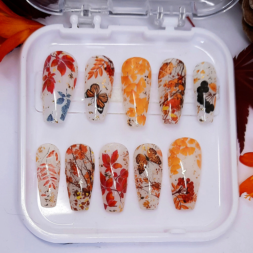 pretty milky white press on nails with Autumn leaves and gold flakes