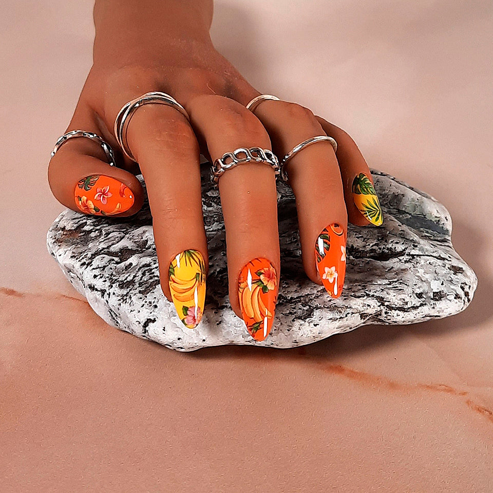 yellow and orange hand made press on nails with a jungle theme