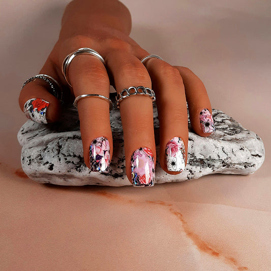 hand made short square press on nails with an abstract floral design with a red and white theme