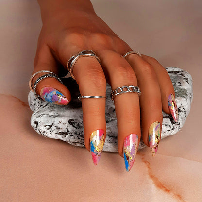 colourful hand made reusable press on nails with an abstract design, in stiletto