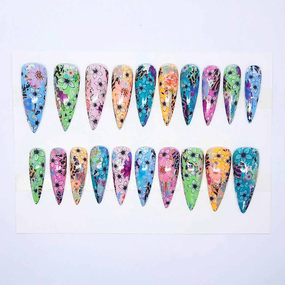 Set of colorful floral nail art designs on a white background
