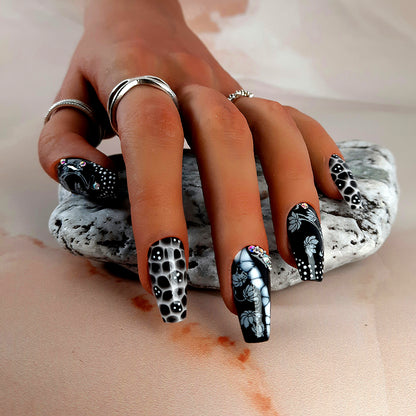 Beautiful hand made coffin press on nails in black and white, and a stunning design with flowers and crystals