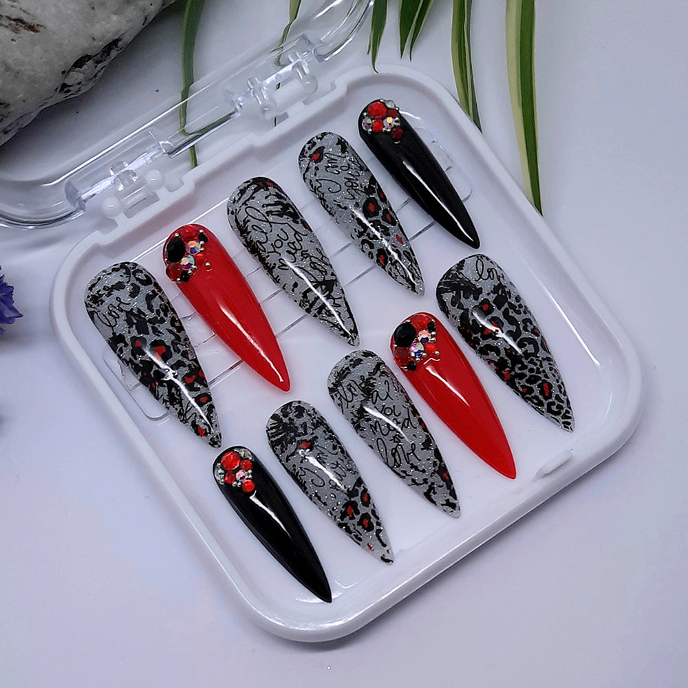 hand made red and black long stiletto press on nails with glitter, animal print and crystals