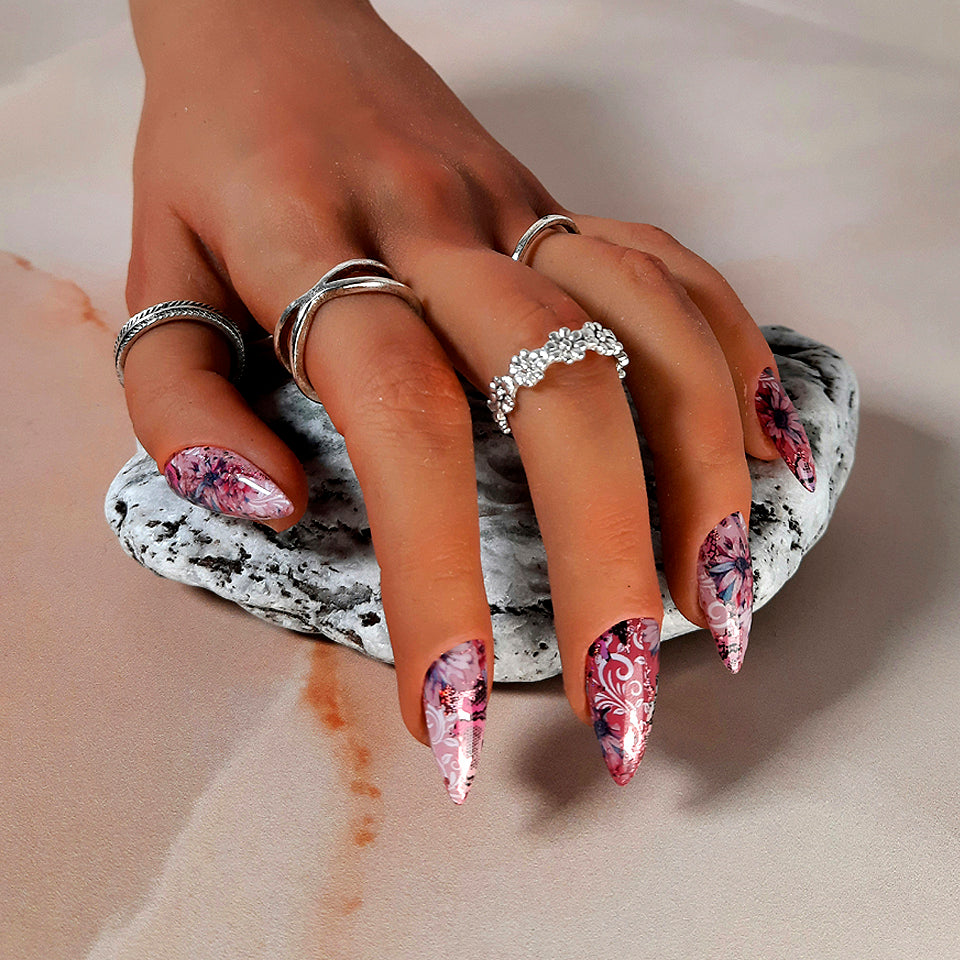 very pretty pink hand made stiletto press on nails with and abstract floral design