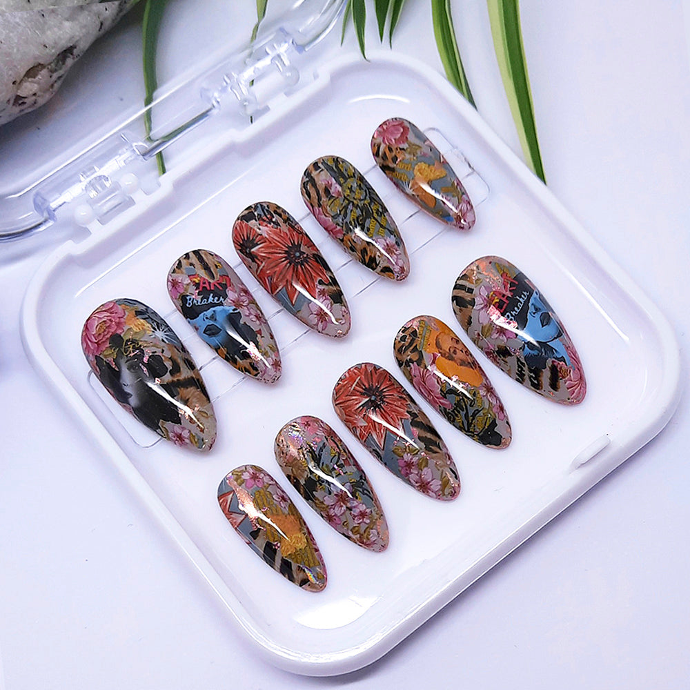 A set of press on nails with an abstract pop art design in multicolours in a white tray.