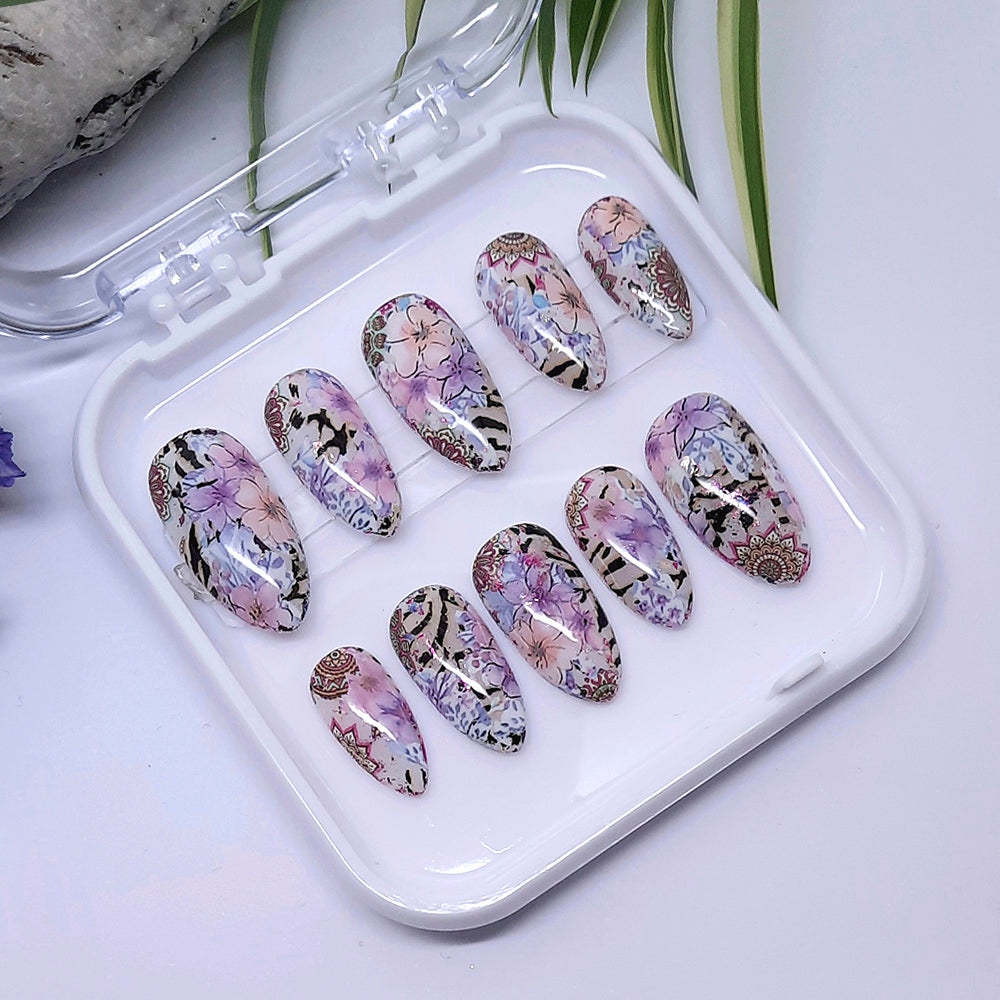 Pretty pastel hand made press on nails with an abstract design of flowers and animal print.