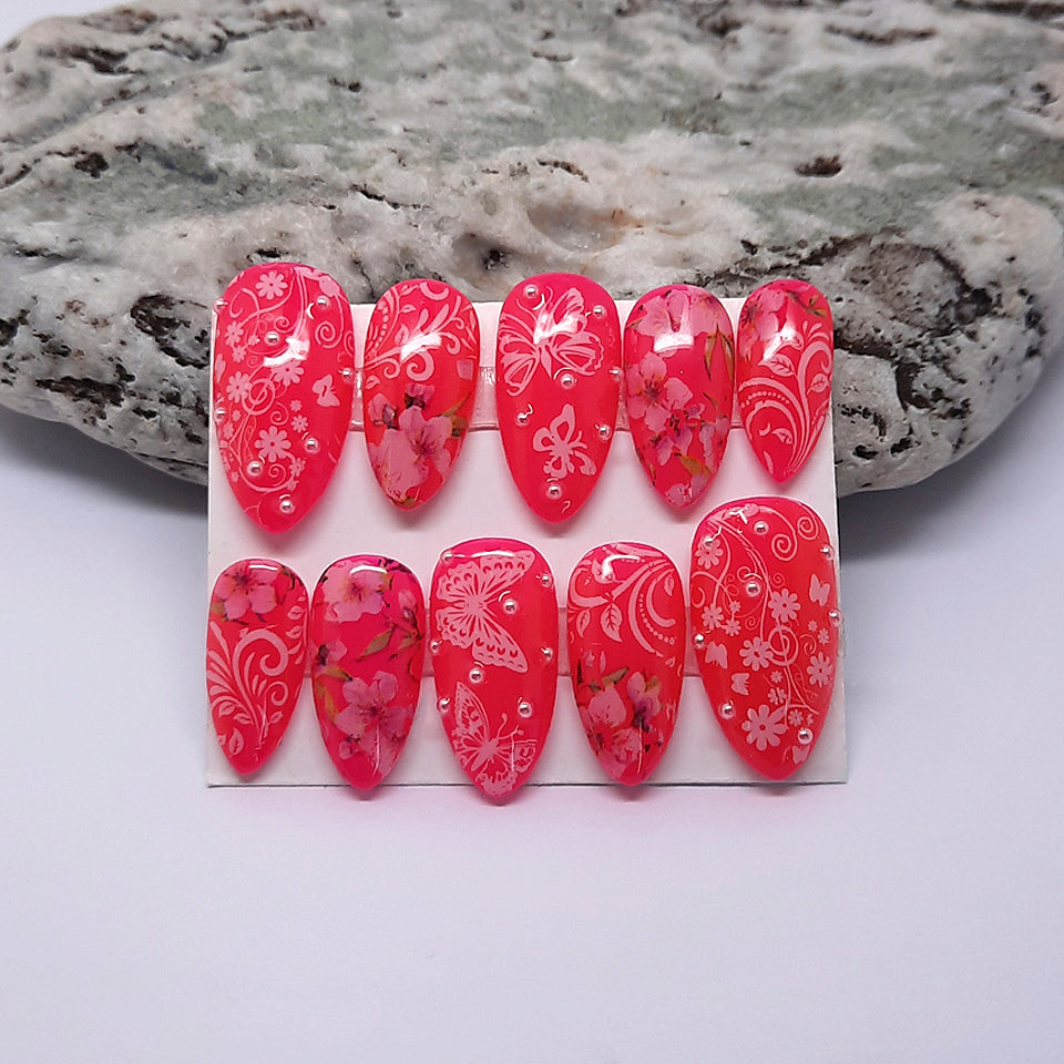 hand made pink press on nails with flowers, butterflies and pearls