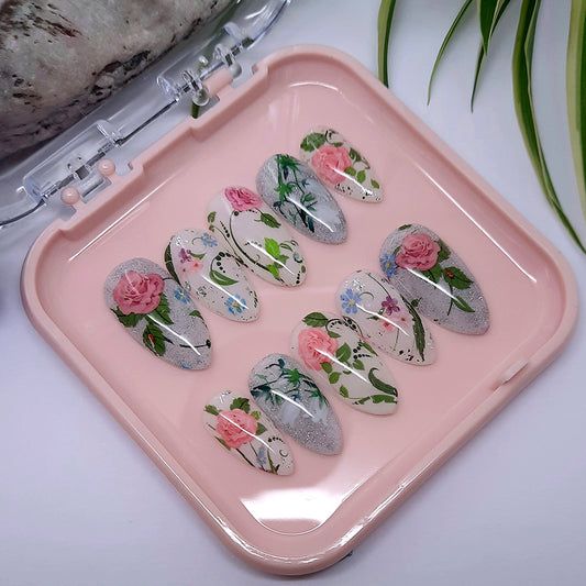 Very pretty press on nails, in milky white with glitter, pink roses, and lily of the valley flowers.
