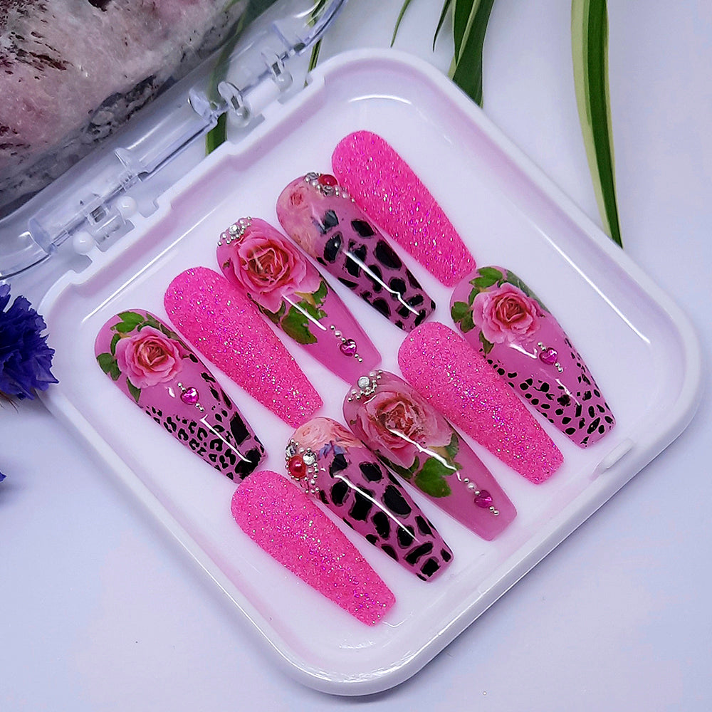 We love these press on nails so much! Pink with animal print, roses, glitter and gems.