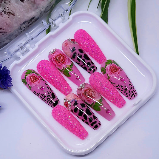 We love these press on nails so much! Pink with animal print, roses, glitter and gems.