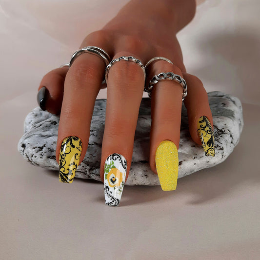 black,yellow and white hand made press on nails with glitter, flowers and black swirls