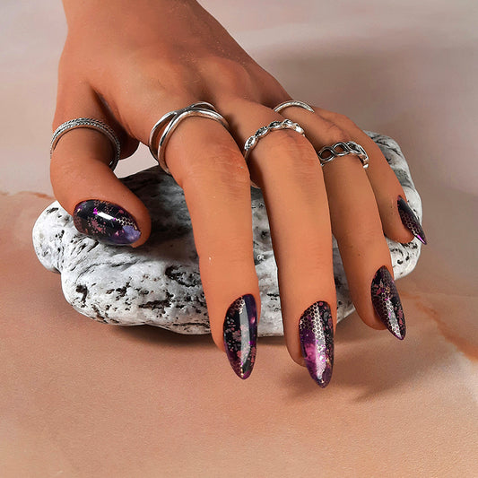 hand made press on nails in purples with an abstract design of flowers, and gold and purple foils