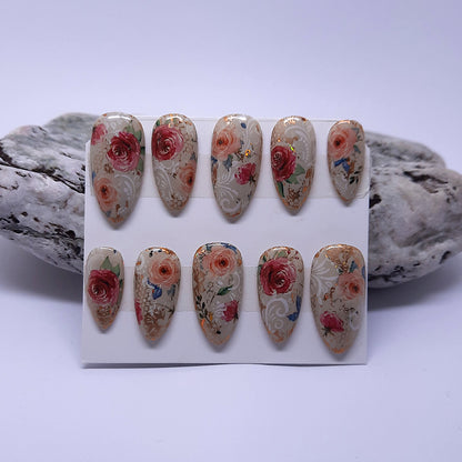 almond press on nails with a beautiful design of antique roses