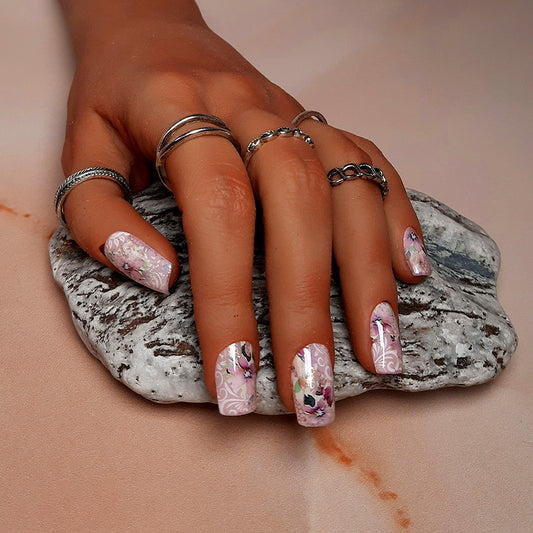 Pretty pink hand made press on nails in short square, with flowers.