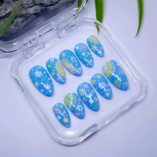 Pretty pastel blue press on nails with hand painted flowers and love hearts.