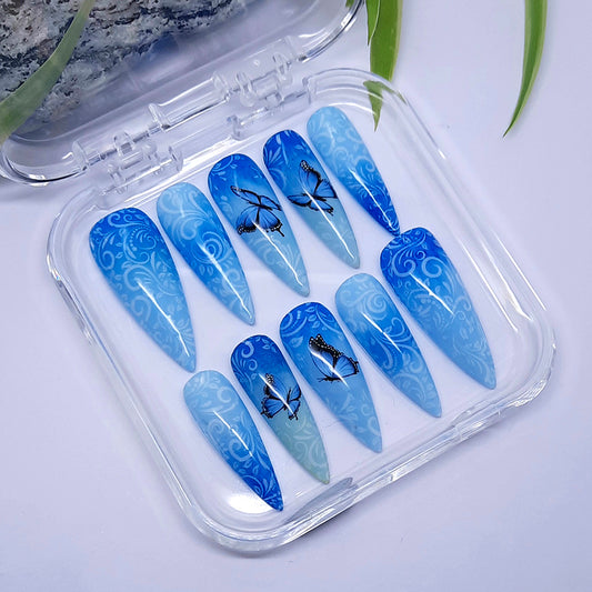 blue ombre hand made stiletto press on nails with butterflies.