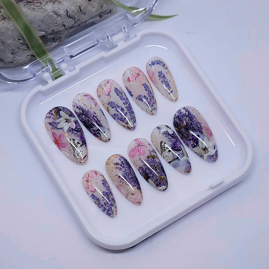 beautiful hand made press on nails in milky white gel polish, with lavender, flowers and butterflies