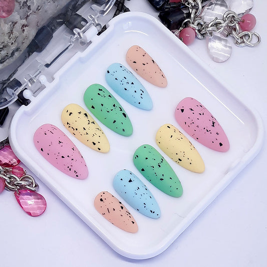 Pastel Mini Egg Press On Nails. Cute mini eggs press on nails in soft pastel colours and a velvety matte top coat.


Please select your size, shape &amp; length.&nbsp; Medium Almond is pictured.

Unsure of your size? Please read our info on sizing, you can also purchase one of our sizing kits to be absolutely sure of a perfect fit.

Every order of Moona press on nails comes with a free application kit.