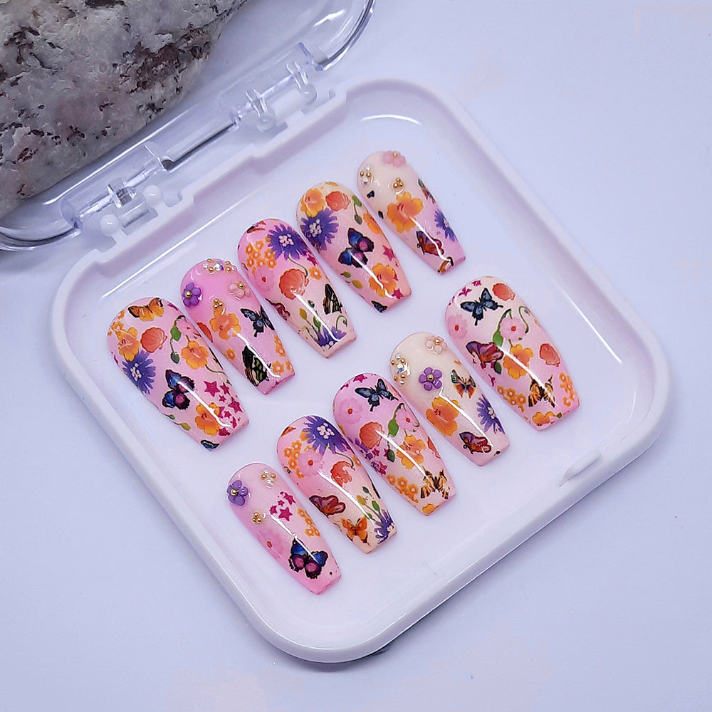 hand made coffin press on nails in soft colours with butterflies and flowers