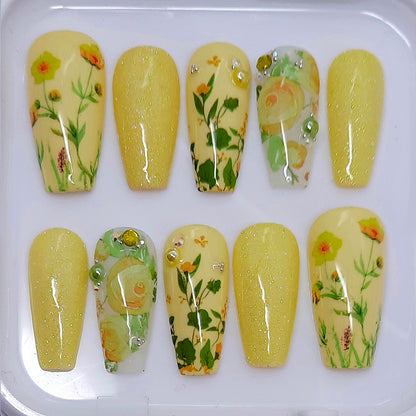 pretty pastel yellow hand made press on nails with flowers, glitter and gems