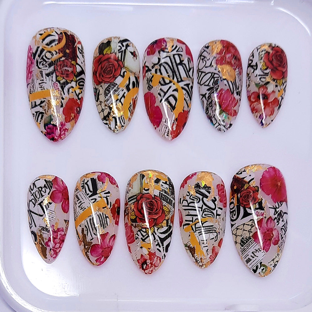 hand made short almond press on nails with an abstract designer and flowers design