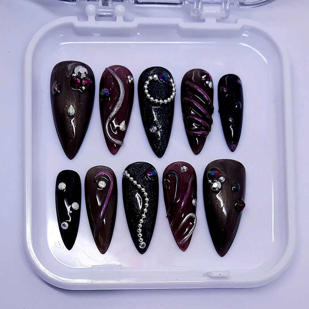 hand made stiletto press on nails with a funky 3d design